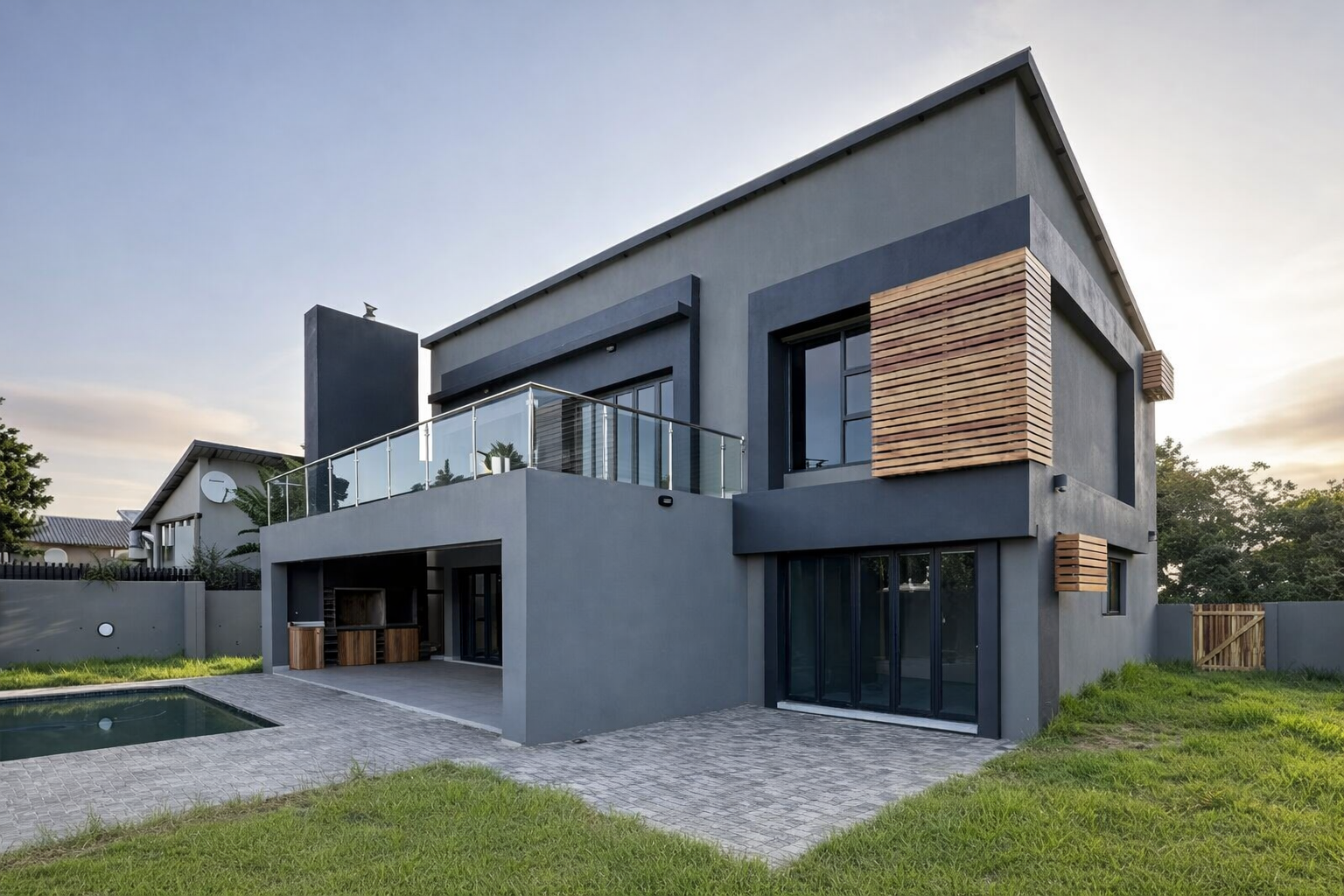 Modern home with pool at sunset.png
